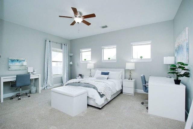 9303 Georgetown Glen Cir, Cypress, TX 77433 - bedroom with a desk, light colored carpet, and ceiling fan