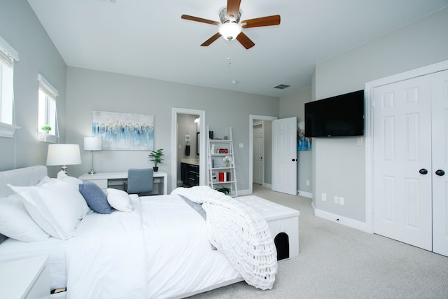 9303 Georgetown Glen Cir, Cypress, TX 77433 - bedroom with a closet, light carpet, a ceiling fan, and ensuite bathroom