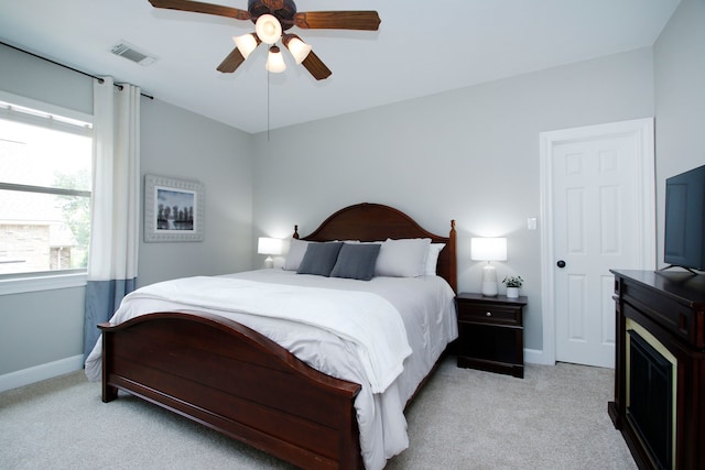 9303 Georgetown Glen Cir, Cypress, TX 77433 - bedroom featuring light carpet and a ceiling fan