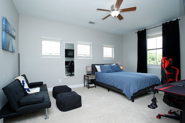9303 Georgetown Glen Cir, Cypress, TX 77433 - bedroom featuring carpet, multiple windows, and a ceiling fan