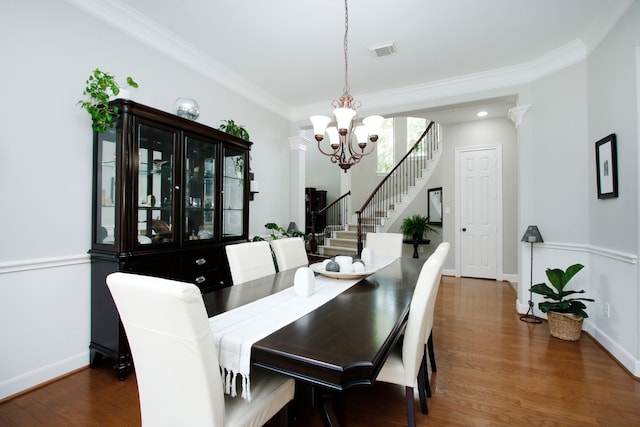 9303 Georgetown Glen Cir, Cypress, TX 77433 - dining room with a chandelier, stairs, dark wood finished floors, and crown molding