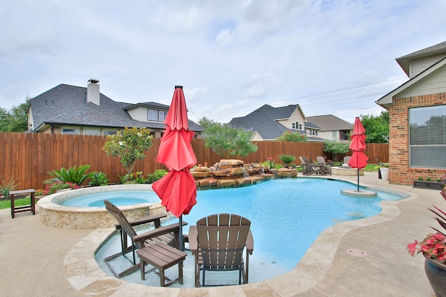 9303 Georgetown Glen Cir, Cypress, TX 77433 - view of swimming pool featuring a patio, a fenced backyard, and a pool with connected hot tub
