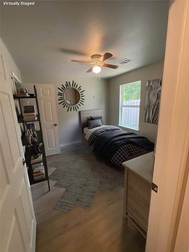 7916 Tate St, Houston, TX 77028 - bedroom with wood finished floors and ceiling fan