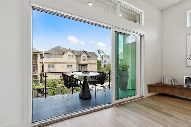 4705 Gibson St, Houston, TX 77007 - doorway to outside featuring wood finished floors, plenty of natural light, and a residential view