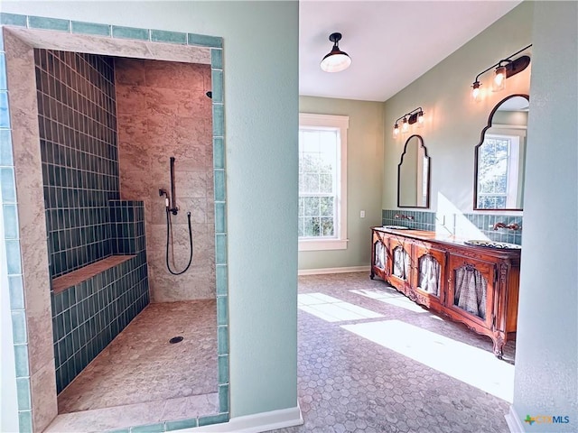 1002 E Gonzales St, Yoakum, TX 77995 - bathroom featuring a walk in shower and double vanity