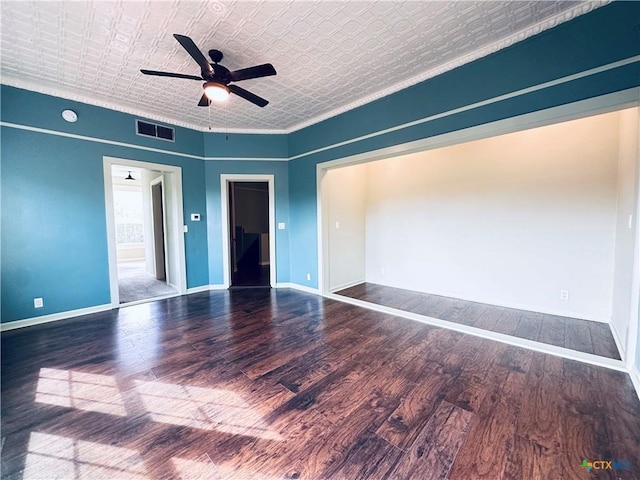 1002 E Gonzales St, Yoakum, TX 77995 - spare room with an ornate ceiling, wood finished floors, ceiling fan, a smoke detector, and ornamental molding
