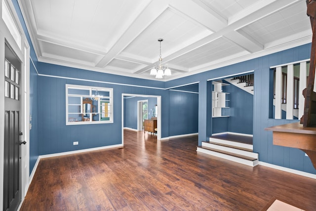 1002 E Gonzales St, Yoakum, TX 77995 - empty room with a chandelier, wood finished floors, stairway, beamed ceiling, and coffered ceiling