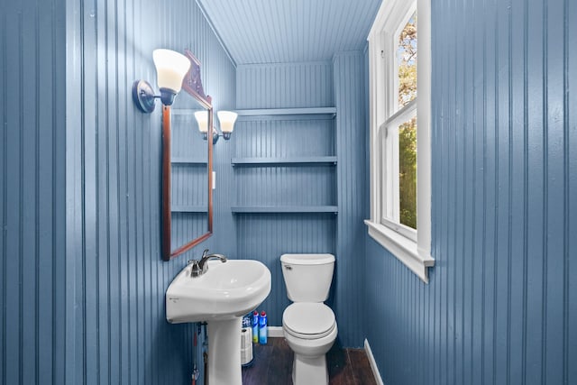 1002 E Gonzales St, Yoakum, TX 77995 - bathroom with toilet and wood finished floors