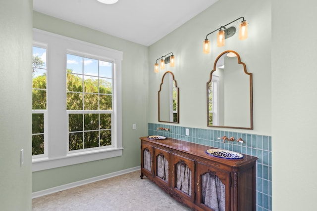 1002 E Gonzales St, Yoakum, TX 77995 - bathroom featuring vanity and baseboards