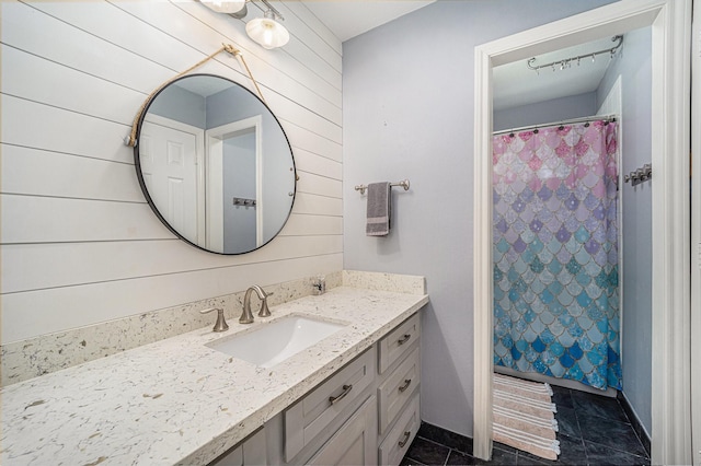 13602 Springmint Dr, Cypress, TX 77429 - bathroom featuring vanity, wood walls, tile patterned flooring, and curtained shower