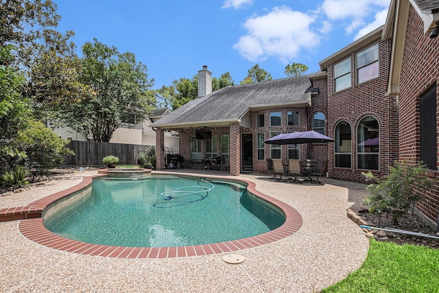 13602 Springmint Dr, Cypress, TX 77429 - view of pool featuring a patio area, a fenced backyard, and a pool with connected hot tub
