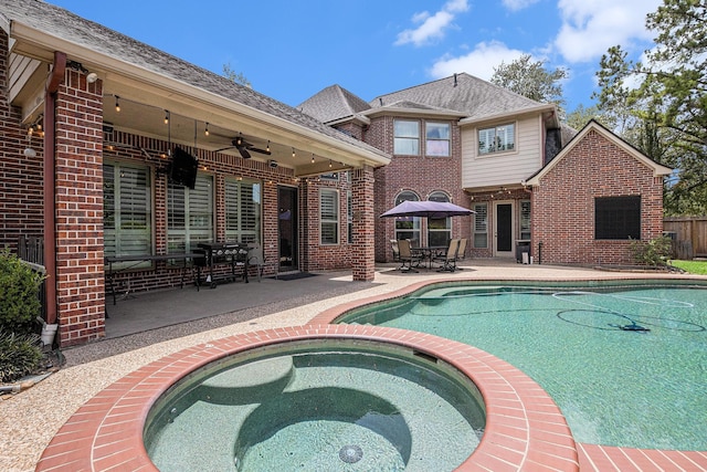 13602 Springmint Dr, Cypress, TX 77429 - view of pool with ceiling fan, a patio, a pool with connected hot tub, and outdoor dining area