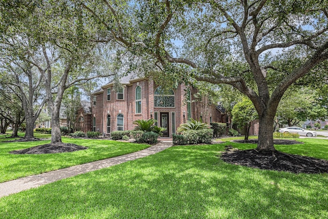 13602 Springmint Dr, Cypress, TX 77429 - view of front of property with brick siding and a front yard