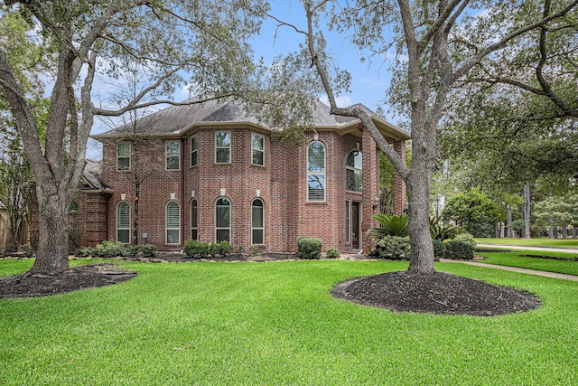13602 Springmint Dr, Cypress, TX 77429 - colonial-style house featuring brick siding and a front yard