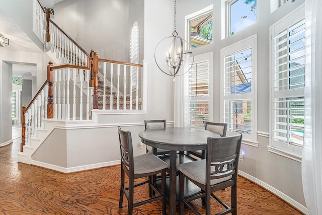 13602 Springmint Dr, Cypress, TX 77429 - dining space with healthy amount of natural light, stairs, wood finished floors, and a towering ceiling
