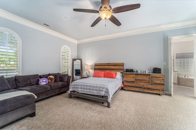 13602 Springmint Dr, Cypress, TX 77429 - carpeted bedroom with crown molding, multiple windows, a ceiling fan, and ensuite bath