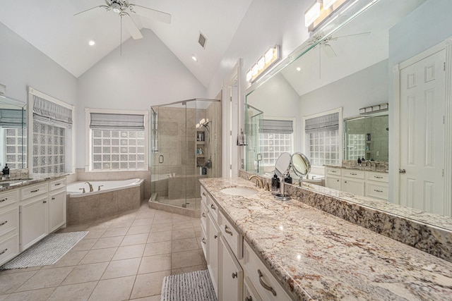 13602 Springmint Dr, Cypress, TX 77429 - bathroom featuring a ceiling fan, two vanities, a bath, and high vaulted ceiling