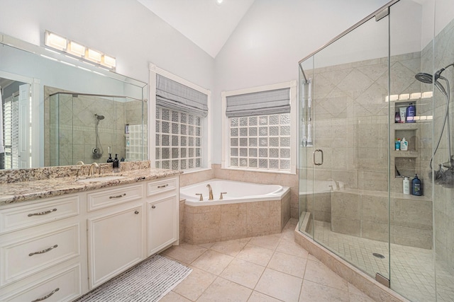 13602 Springmint Dr, Cypress, TX 77429 - full bath with vanity, a garden tub, lofted ceiling, a stall shower, and tile patterned flooring