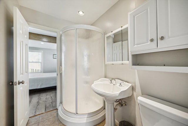 4014 2nd St, Galveston, TX 77554 - bathroom with a stall shower, connected bathroom, and tile patterned flooring