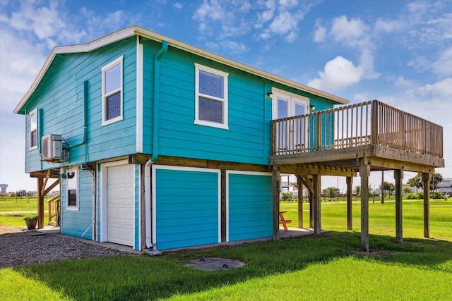 4014 2nd St, Galveston, TX 77554 - back of property with a garage, a wooden deck, and a lawn
