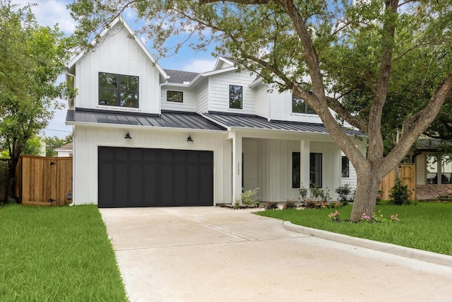 1132 Wakefield Dr, Houston, TX 77018 - modern farmhouse featuring board and batten siding, an attached garage, driveway, and a porch
