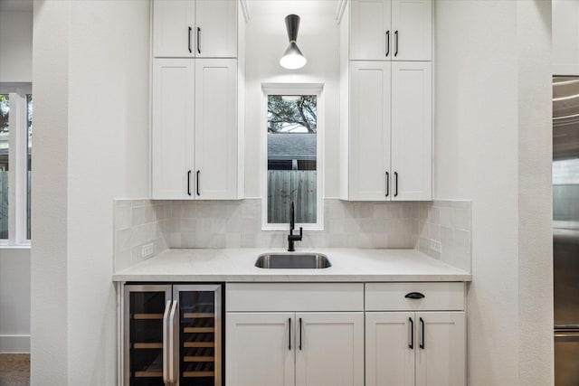 1132 Wakefield Dr, Houston, TX 77018 - bar with beverage cooler and backsplash