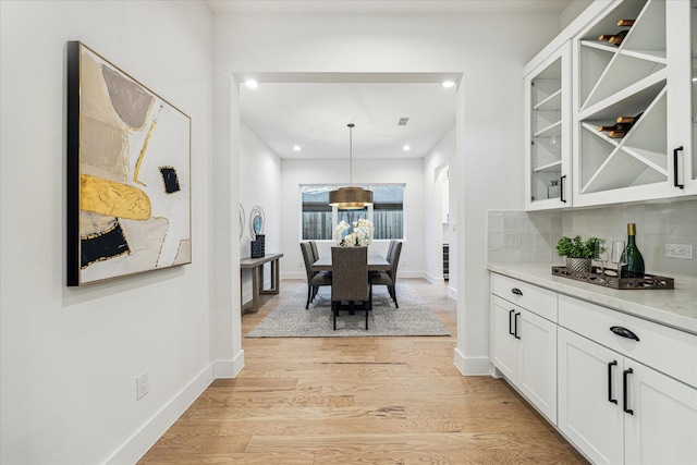 1132 Wakefield Dr, Houston, TX 77018 - dining space with light wood finished floors, recessed lighting, and a chandelier