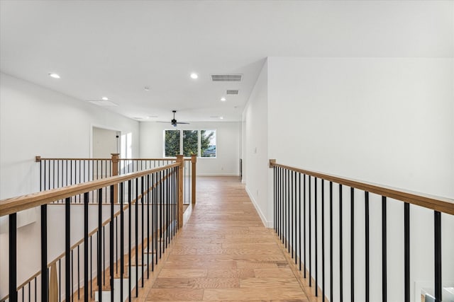 1132 Wakefield Dr, Houston, TX 77018 - hall with an upstairs landing, light wood finished floors, and recessed lighting