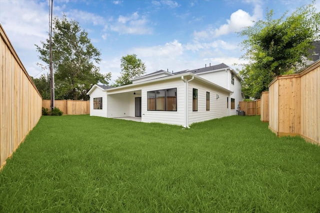 1132 Wakefield Dr, Houston, TX 77018 - rear view of house with a fenced backyard, ceiling fan, and a patio