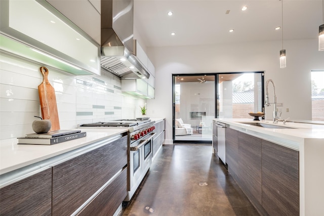 909 Peden St, Houston, TX 77006 - kitchen featuring appliances with stainless steel finishes, modern cabinets, wall chimney exhaust hood, light countertops, and recessed lighting