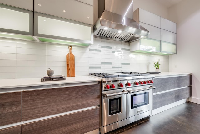 909 Peden St, Houston, TX 77006 - kitchen with double oven range, wall chimney range hood, modern cabinets, and light countertops