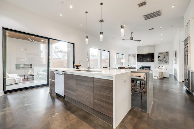 909 Peden St, Houston, TX 77006 - kitchen with modern cabinets, ceiling fan, finished concrete floors, and recessed lighting