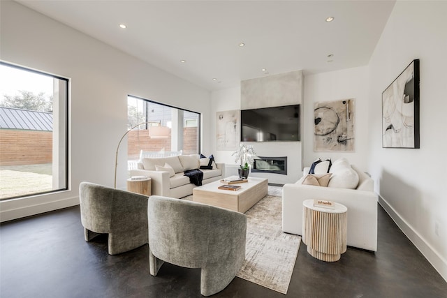 909 Peden St, Houston, TX 77006 - living room with recessed lighting, finished concrete floors, and a large fireplace