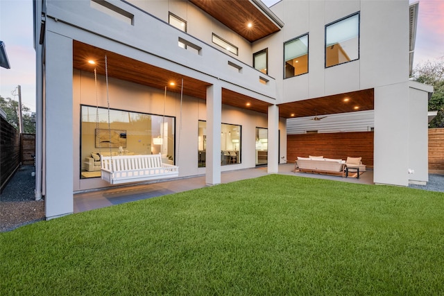 909 Peden St, Houston, TX 77006 - back of house featuring an outdoor living space, a patio, and stucco siding