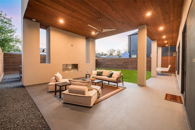 909 Peden St, Houston, TX 77006 - fenced backyard featuring an outdoor hangout area, a patio area, and ceiling fan