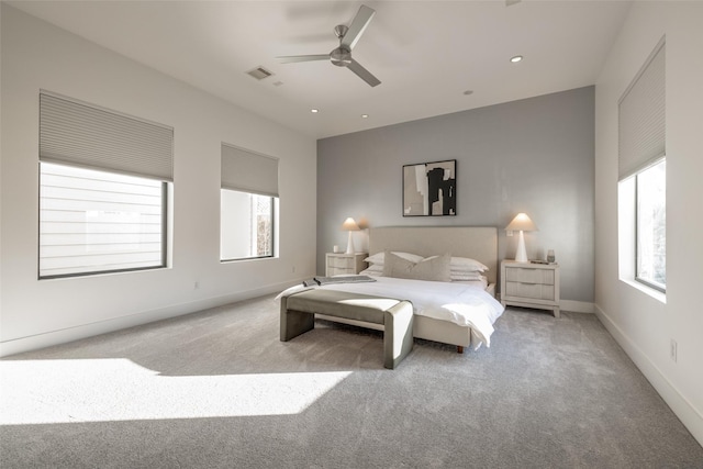 909 Peden St, Houston, TX 77006 - carpeted bedroom featuring multiple windows, a ceiling fan, and recessed lighting
