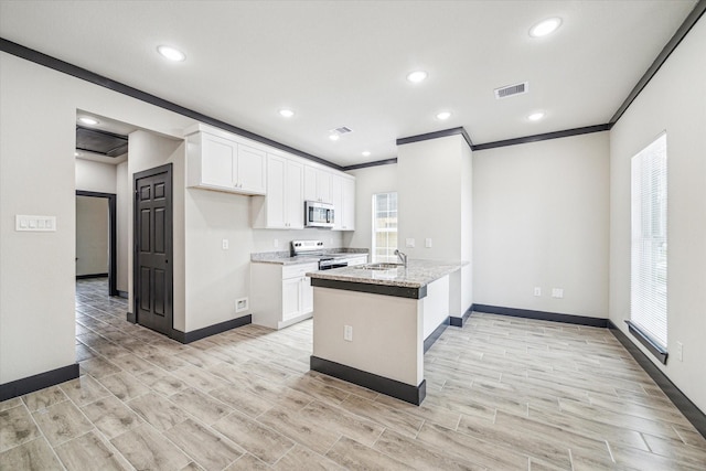 9412 Crofton St, Houston, TX 77016 - kitchen with stainless steel appliances, white cabinetry, crown molding, light stone counters, and recessed lighting