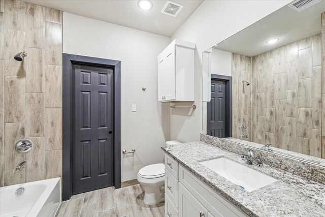9412 Crofton St, Houston, TX 77016 - full bathroom featuring vanity, bathtub / shower combination, and recessed lighting