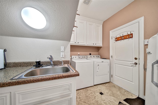 12540 Longmire Lakeview, Conroe, TX 77304 - laundry room with cabinet space, independent washer and dryer, and light tile patterned flooring