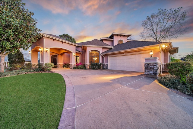 12540 Longmire Lakeview, Conroe, TX 77304 - mediterranean / spanish home with stucco siding, driveway, a garage, a front yard, and stone siding