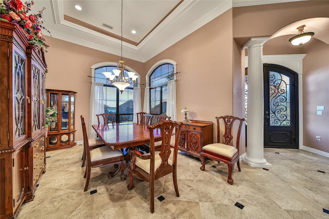 12540 Longmire Lakeview, Conroe, TX 77304 - dining room featuring ornate columns, a chandelier, crown molding, recessed lighting, and a tray ceiling