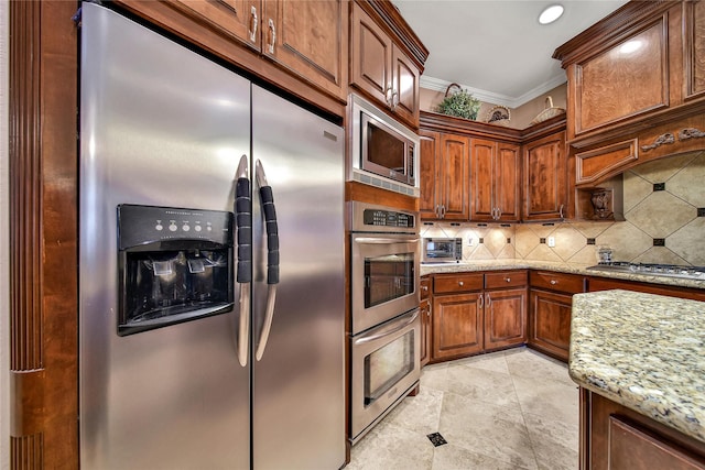 12540 Longmire Lakeview, Conroe, TX 77304 - kitchen with appliances with stainless steel finishes, decorative backsplash, light stone counters, crown molding, and brown cabinetry