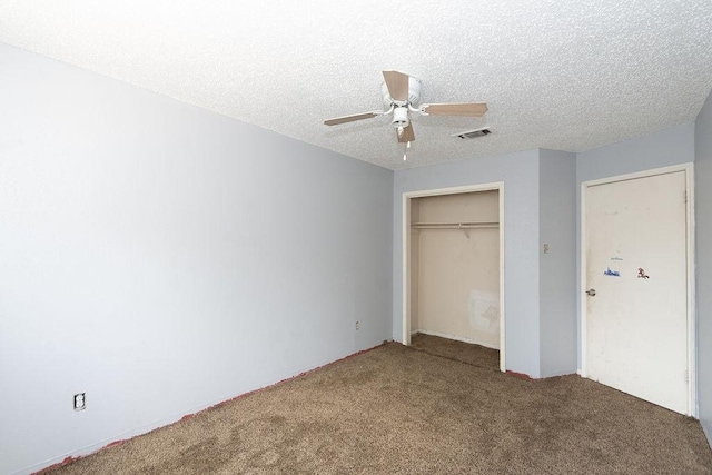 12254 Wild Pine Dr Unit A, Houston, TX 77039 - unfurnished bedroom featuring carpet flooring, a closet, a ceiling fan, and a textured ceiling