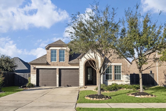 714 Fresh Sage Xing, Richmond, TX 77406 - view of front of property with brick siding, concrete driveway, roof with shingles, and stone siding