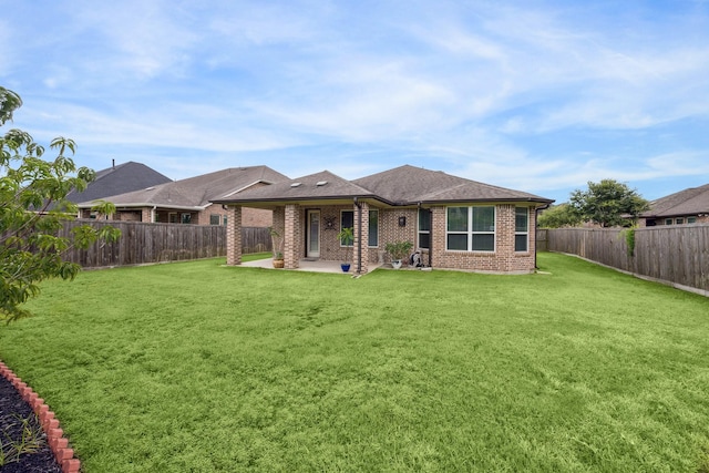 714 Fresh Sage Xing, Richmond, TX 77406 - rear view of property with brick siding, a patio, a fenced backyard, and roof with shingles