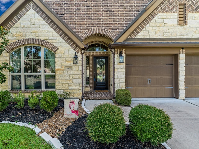 4006 Trento Ct, Katy, TX 77493 - property entrance with stone siding, concrete driveway, and brick siding