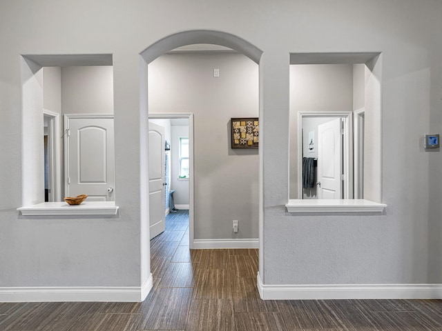 4006 Trento Ct, Katy, TX 77493 - hall with arched walkways and dark wood-style floors