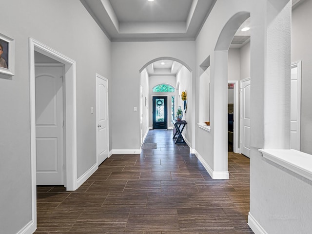 4006 Trento Ct, Katy, TX 77493 - foyer with arched walkways, a tray ceiling, and wood finish floors