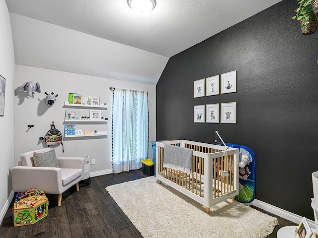 4006 Trento Ct, Katy, TX 77493 - bedroom with lofted ceiling, a crib, and wood finished floors