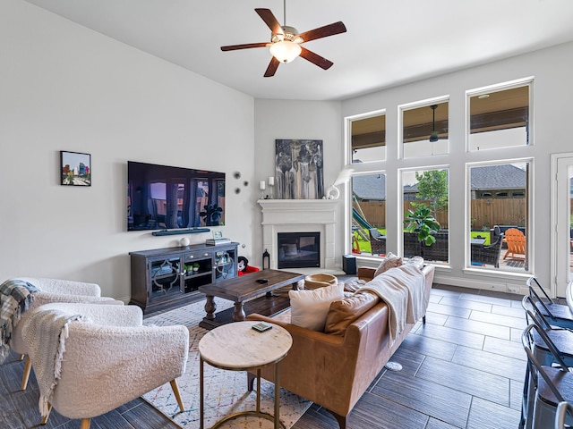 4006 Trento Ct, Katy, TX 77493 - living room with ceiling fan and a glass covered fireplace